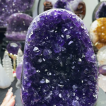 Museum-quality 10 lb tall Uruguayan amethyst cathedral known as the Royal Violet Mountain, featuring large imperial purple crystals on a custom wood stand