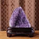 One-of-a-kind deep purple amethyst cave with a perfectly balanced, broad silhouette resting on a custom wood stand, specimen number 4
