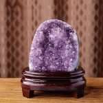 One-of-a-kind compact and rounded deep purple amethyst cave nesting in a custom wood stand, specimen number 5