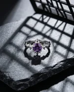 "AAA-grade natural oval amethyst in a vintage Victorian-style sterling silver filigree adjustable ring setting."