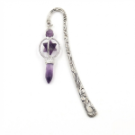 A vintage-style silver metal hook bookmark featuring a dangling amethyst point crystal and a Merkaba star stone, intricately engraved with sun and wave motifs.