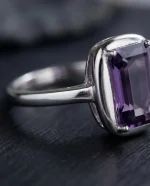 Classic Amethyst Solitaire Ring featuring a brilliant-cut natural purple gemstone in a vintage-textured 925 sterling silver adjustable setting.