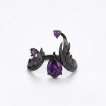 Top view of the 'Dark Renaissance' Dark Aesthetic Amethyst Ring, showcasing the deep violet amethyst secured by complex black rhodium Italian filigree work.