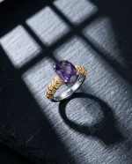 Modernist Amethyst Ring featuring a natural oval crystal elevated in a high-prong 925 sterling silver adjustable setting.