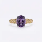 Modernist Amethyst Ring featuring a natural oval crystal elevated in a high-prong 925 sterling silver adjustable setting.