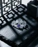Deep royal purple natural amethyst solitaire ring featuring a classic four-prong 925 sterling silver adjustable setting.