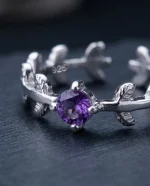 Deep royal purple natural amethyst solitaire ring featuring a classic four-prong 925 sterling silver adjustable setting.