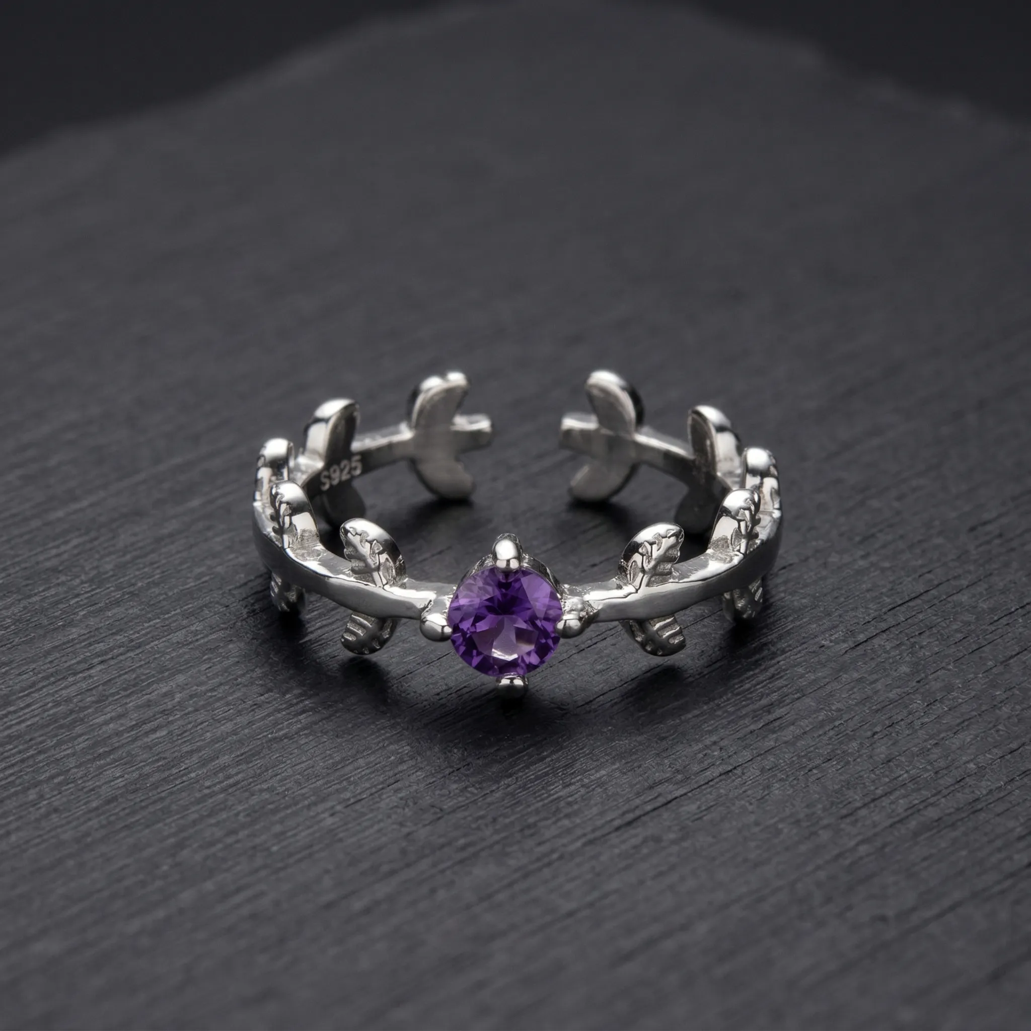 Deep royal purple natural amethyst solitaire ring featuring a classic four-prong 925 sterling silver adjustable setting.