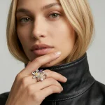 High-fashion model posing with the Zenith Lotus Amethyst Ring, highlighting its sophisticated botanical aesthetic and unique hand-carved details.