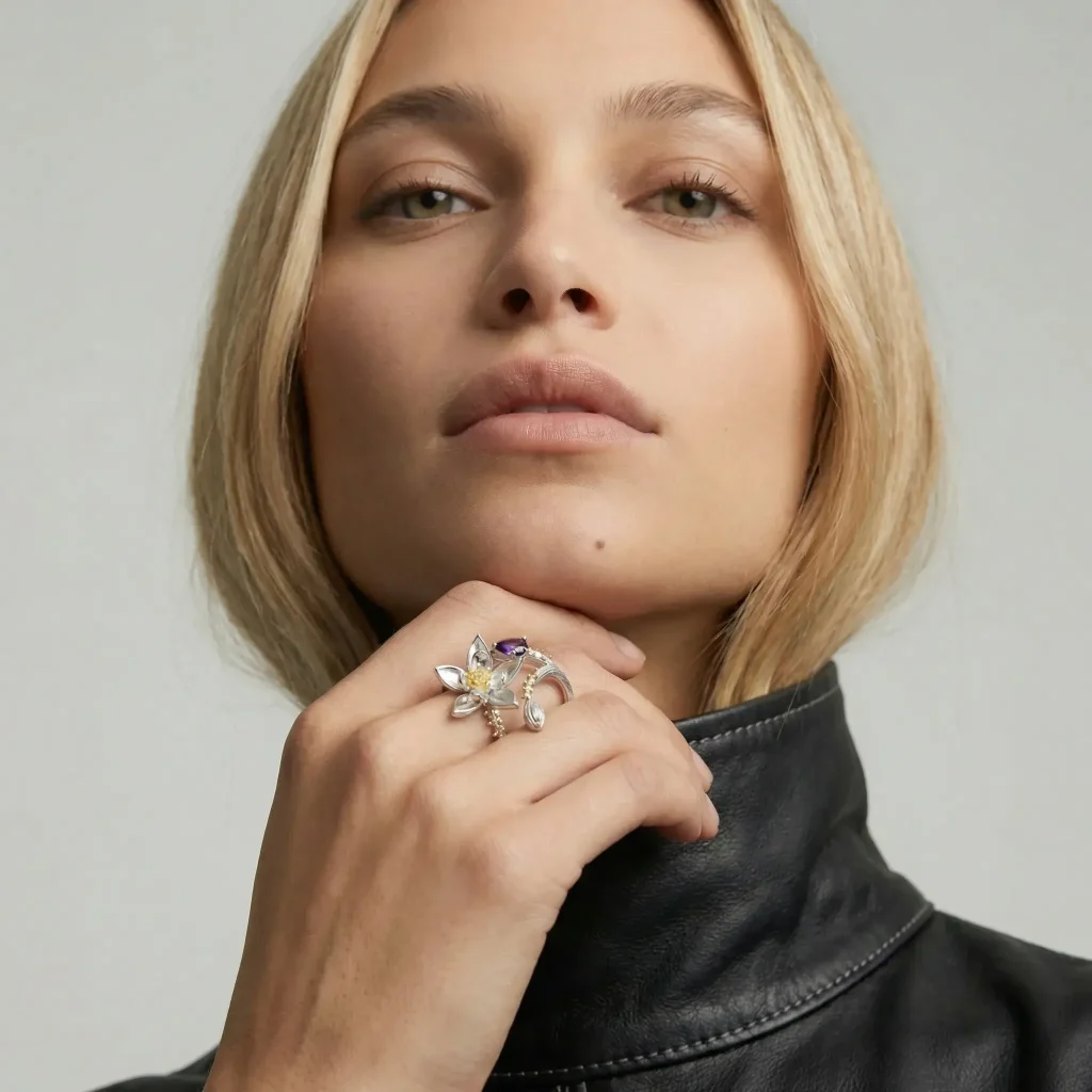 Model wearing the Zenith Lotus Amethyst Ring, showcasing its nature-inspired sculptural design and substantial artistic presence.