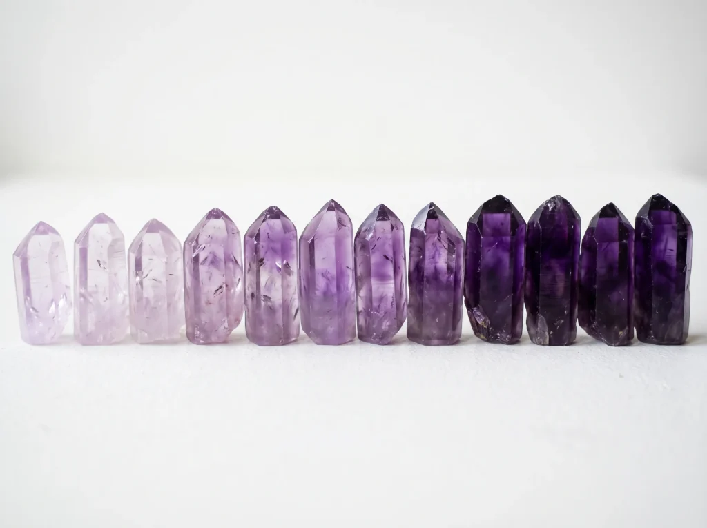 february birthstone amethyst color range — lavender to deep royal purple natural crystal gradient